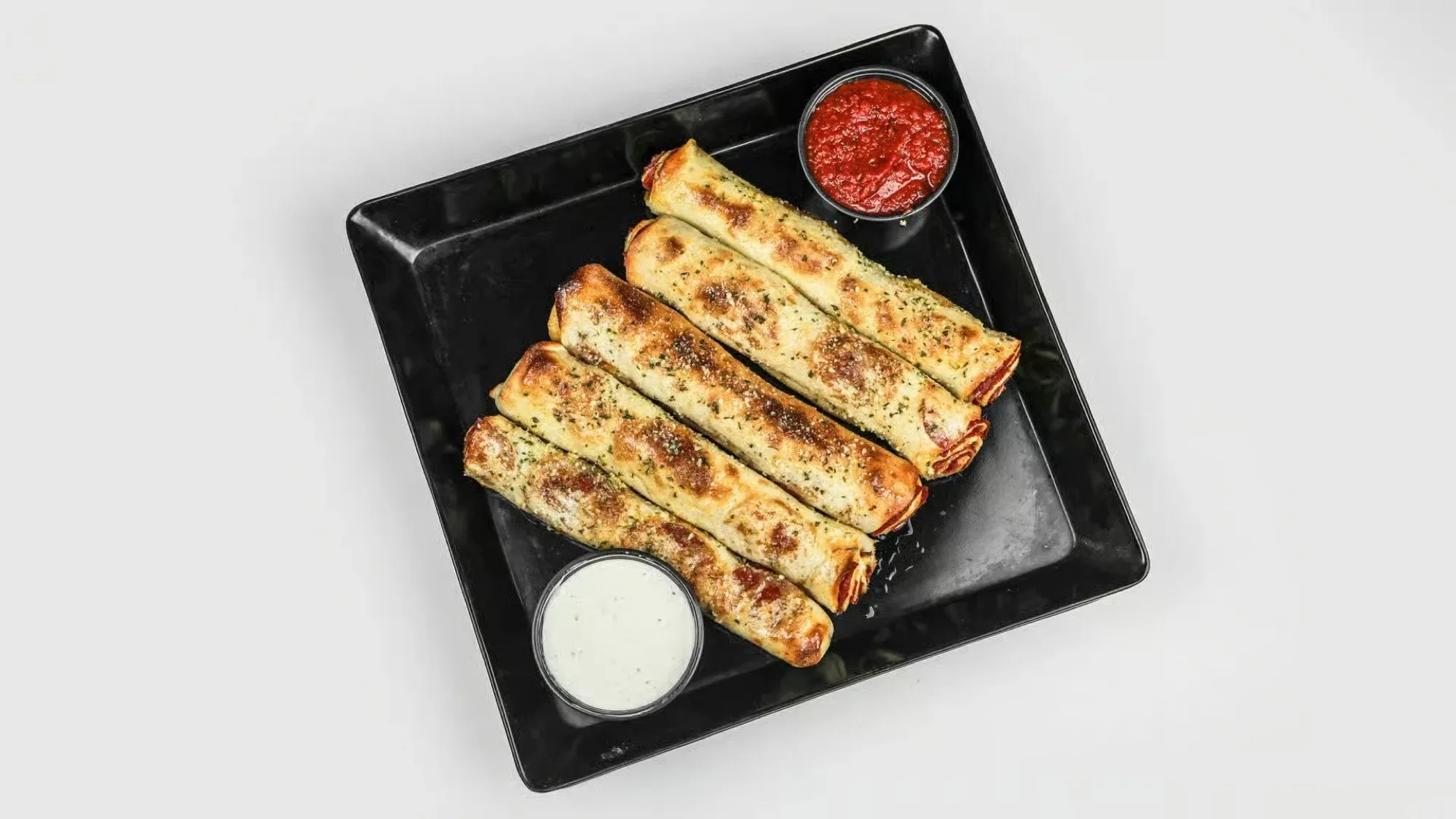 Hand pulled pepperoni bread sticks from Round Haus with marinara and ranch.